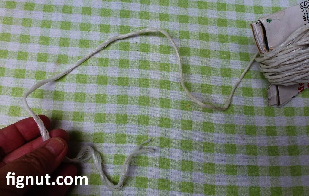 Get a small piece of rope, cut to length and prepare it to tie the sage bundle